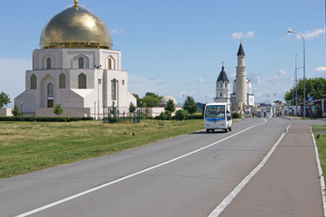 Bulgarians - entrance to the complex and electric car on the road