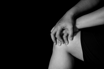 woman suffering from pain in knee