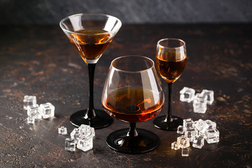 Set of strong alcoholic drinks in glasses