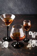 Set of strong alcoholic drinks in glasses