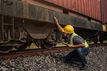 Worker checking on the train.