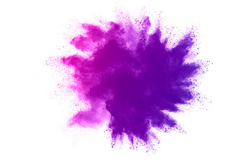 Freeze motion of purple color powder exploding on white background.