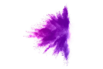 Fototapeta premium Freeze motion of purple color powder exploding on white background.