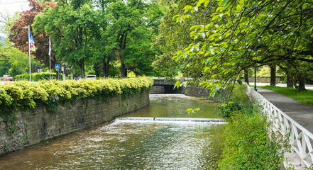 Waterfall in summer old city.
