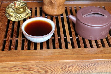 Chinese tea ceremony using tea utensils made of glass, clay and porcelain.