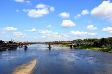 Srednicowy railway bridge and Swietokszyski bridge in Warsaw, Poland. Low water level in the Vistula river. View from the Poniatowski bridge.