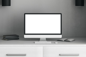 Creative desktop with white laptop