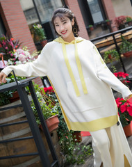 Asian girls in yellow fashion dress show glamour on the streets of Shanghai