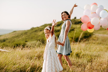 Mom and daughter have fun in nature