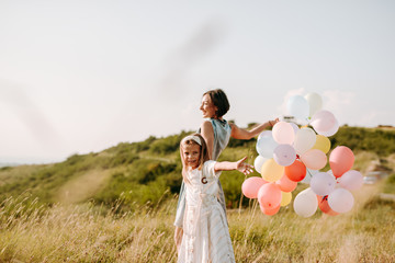 Mom and daughter have fun in nature