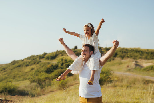 Father and daughter have fun in nature