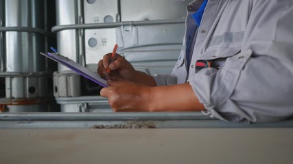 Engineer to check quality and quantity of chemical tank in warehouse, Industrial and chemical plant concept