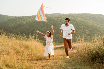Father and daughter have fun in nature