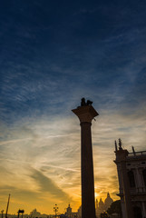 Beautiful sunset sky over Venice monuments and Saint Mark basin (with copy space above)
