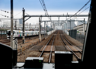 Japan train is traveling between stations in Tokyo , View from control room