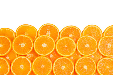 Slices of oranges as a background, top view.