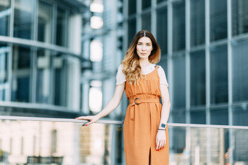  stylish image in the modern architecture of the building. a bright young girl in Berlin.