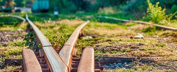 Rusty rails of an abandoned railway close-up