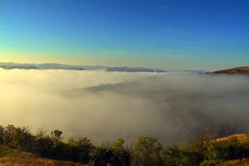 the fog between the hills