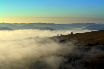 Obraz na płótnie Canvas fog between hills in the morning