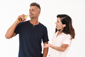 Young couple wearing casual outfit standing isolated
