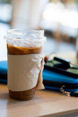 Iced coffee with tissues sleeve and lid, you can drink coffee pass lid replace straw