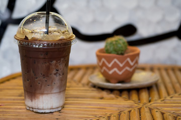 Iced mocha coffee on wooden table