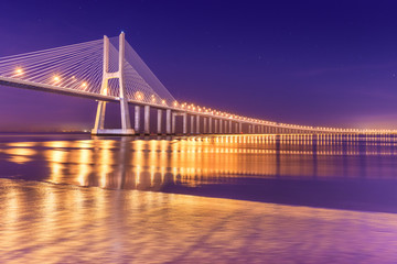 View of a modern cable-stayed bridge at night (Vasco da Gama Bridge), Lisbon, Portugal