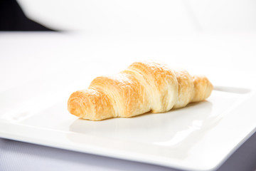 croissant with salmon on a white background