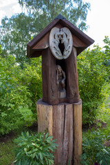  Vintage wooden beehives in a rural yard. Apiary of European peasants.