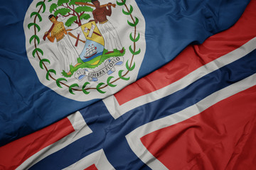 waving colorful flag of norway and national flag of belize.