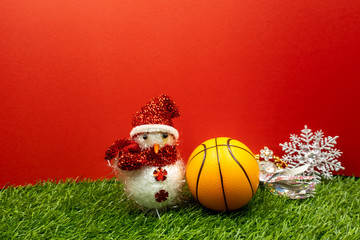 Basketball Christmas with basketball and Christmas ornament on green grass