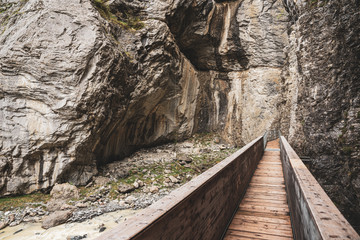 Wooden footbridge in the glacier gorge in Grindelwald