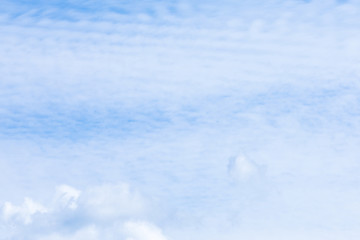 Obraz premium The vivid sky or heaven background with white and blue Cirrus and layered clouds under the sun rays