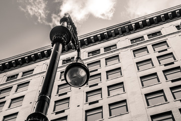 Vintage street lamp and New York City architecture.