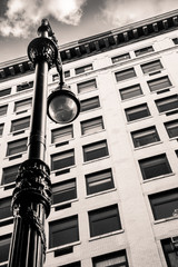 Vintage street lamp and New York City architecture.
