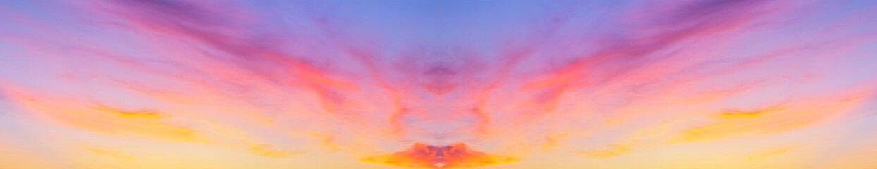 Obraz premium Collage with a horizontal reflection of the panorama of the sunset sky with pink layered clouds. Natural abstract adverse background