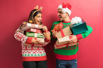 Boyfriend And Girlfriend With Christmas Gifts In Studio