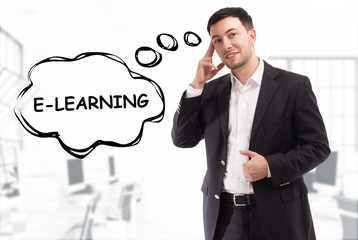 Business, technology, internet and network concept. The young businessman comes up with the keyword: E-learning