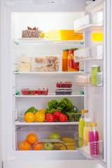 Fototapeta na wymiar white fridge with different food