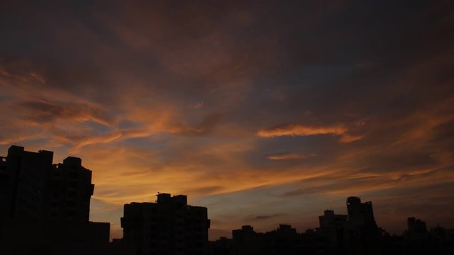 Dramatic city sky view different beautiful colors of sunset in monsoon season  