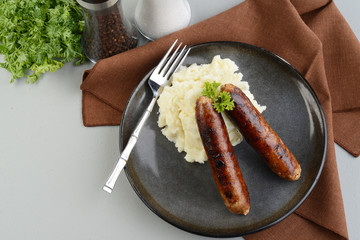  top view chorizo sausages with a fork and parsley