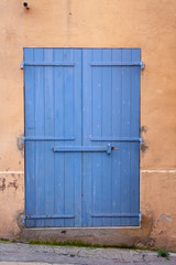 Beautiful blue door in a narrow street in Marseille