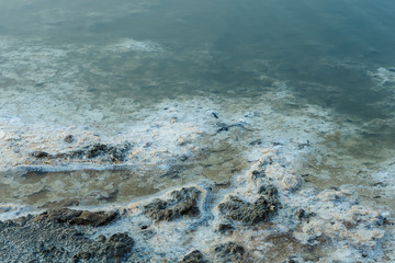 close up of high resolution texture of crystallized salt in a lake. space landscapes. Beatiful colors of nature. Travel photo background. Dried sea salt in the ground