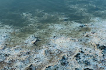 close up of high resolution texture of crystallized salt in a lake. space landscapes. Beatiful colors of nature. Travel photo background. Dried sea salt in the ground
