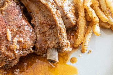 Cooked Pork Ribs with french fries