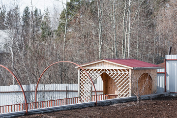 Wooden gazebo for recreation installed on pier.
