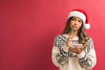 Thoughtful Latin Woman Preparing Xmas List