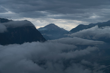 Fototapeta na wymiar A mountain range in the clouds - blue colors