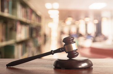 Justice gavel on blurred library background